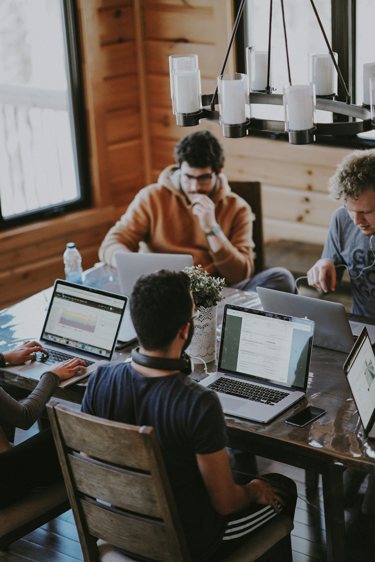 Illustrative photograph of people collaborating around a table